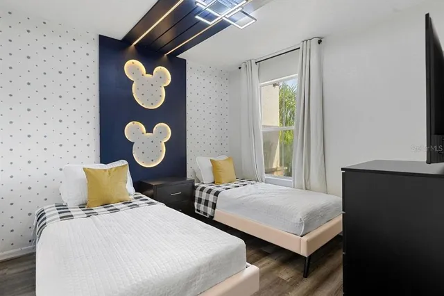 a bedroom with double bed and a window