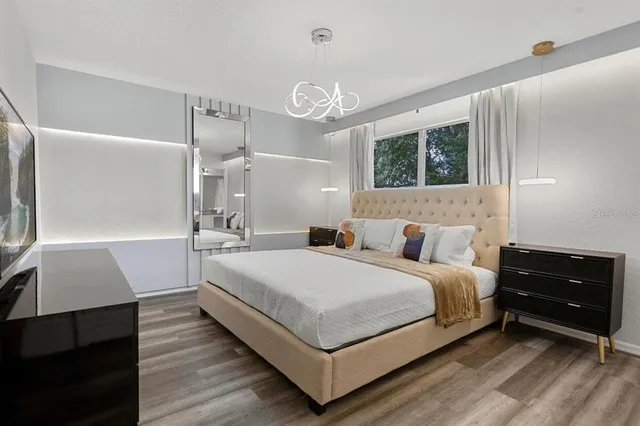 a bedroom with a bed and a dresser