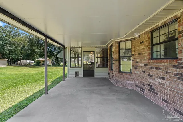 a view of a hallway view with wooden floor and staircase