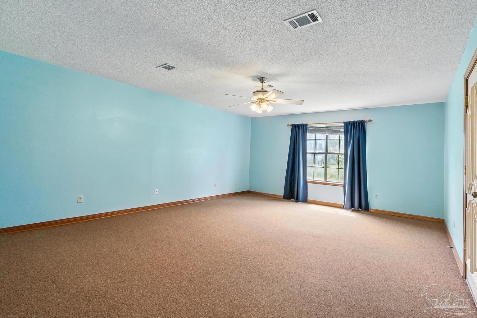 6160 Saddle Club Road Pace, FL 32571 - Photo 41 of 49 a view of an empty room with a window