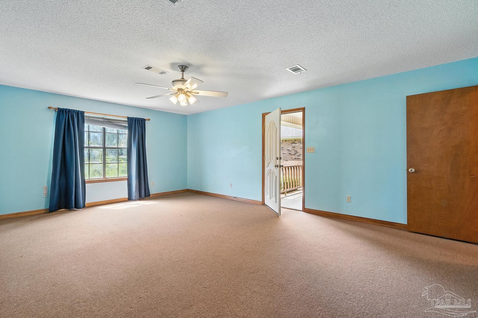6160 Saddle Club Road Pace, FL 32571 - Photo 42 of 49 a view of an empty room with a window