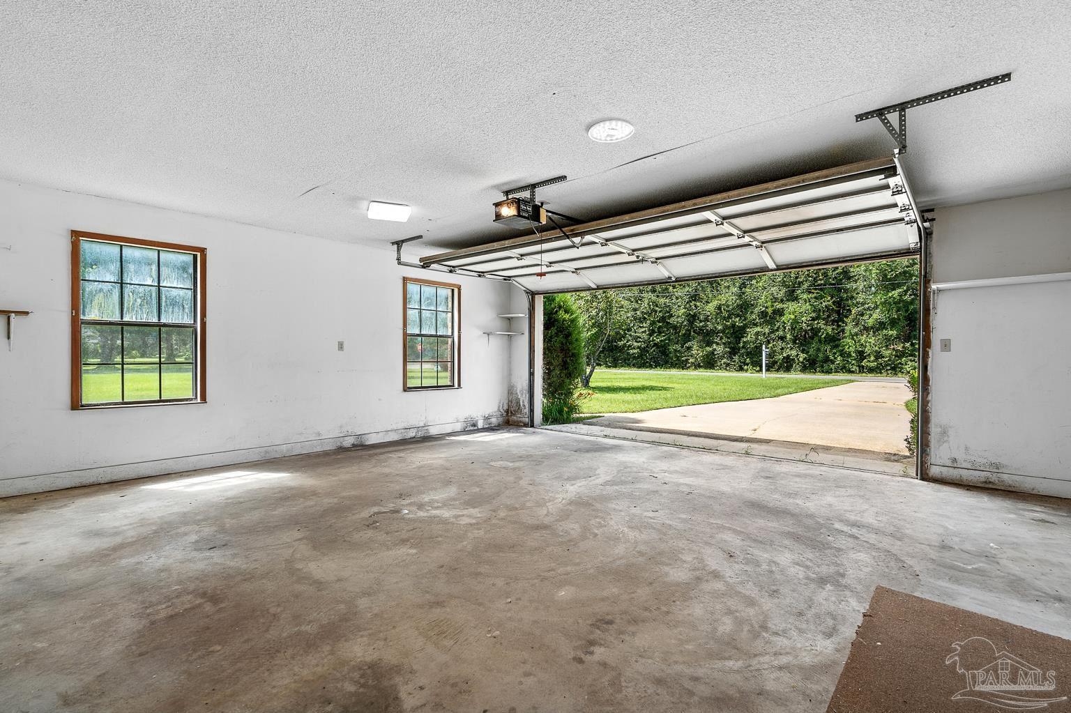 6160 Saddle Club Road Pace, FL 32571 - Photo 44 of 49 a view of empty room with windows