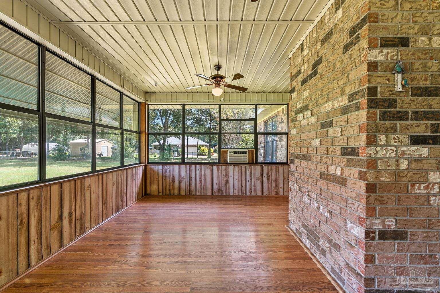 6160 Saddle Club Road Pace, FL 32571 - Photo 46 of 49 a view of entryway with a floor to ceiling window