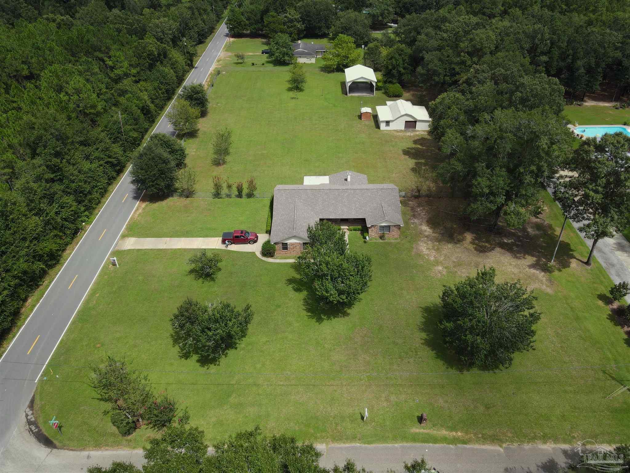 6160 Saddle Club Road Pace, FL 32571 - Photo 48 of 49 an aerial view of a house