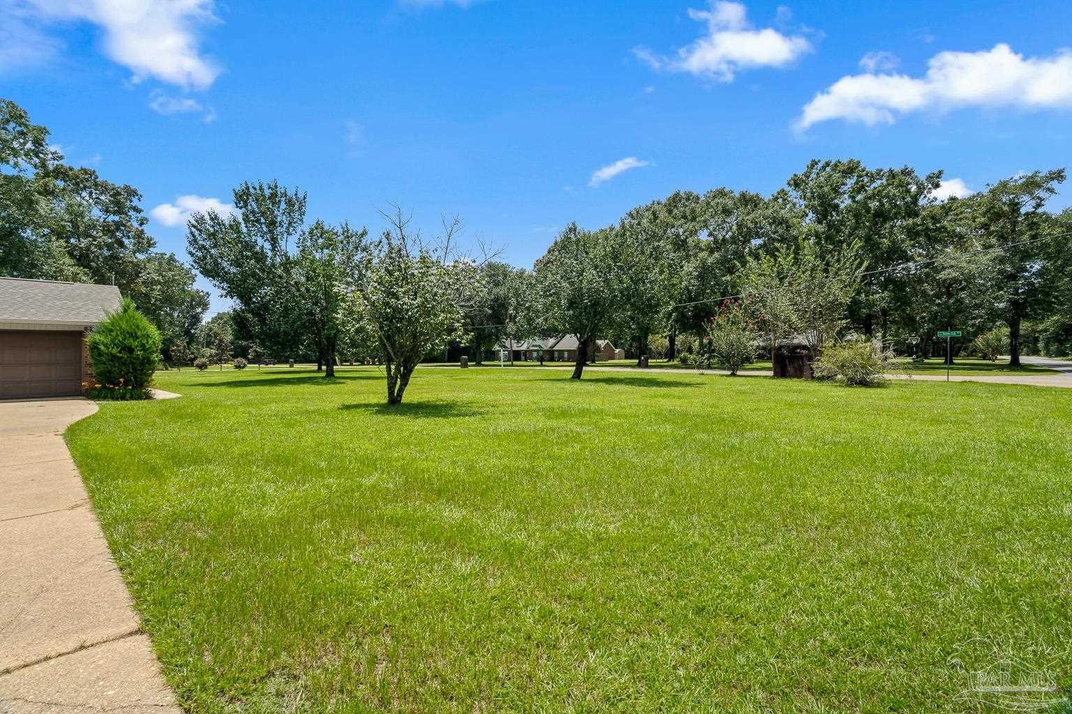 6160 Saddle Club Road Pace, FL 32571 - Photo 5 of 49 a park with trees in the background