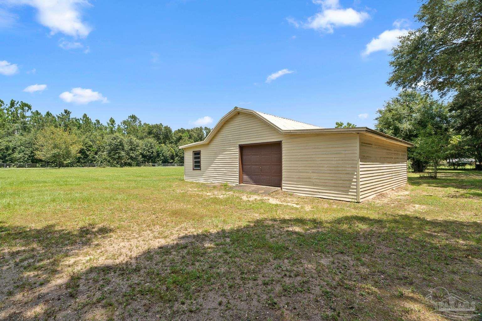 6160 Saddle Club Road Pace, FL 32571 - Photo 10 of 49 a view of a backyard of the house