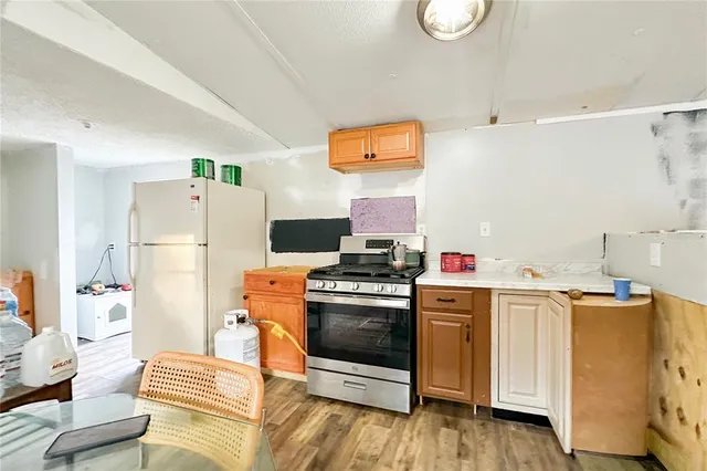 a kitchen with stainless steel appliances and white cabinets