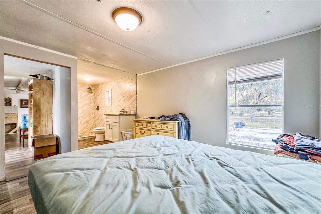 198 Spurlock Road Frostproof, FL 33843 - Photo 25 of 50 a bedroom with a bed and a window
