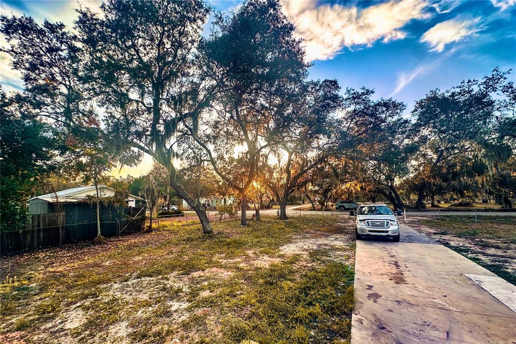 198 Spurlock Road Frostproof, FL 33843 - Photo 49 of 50 a park view with large trees