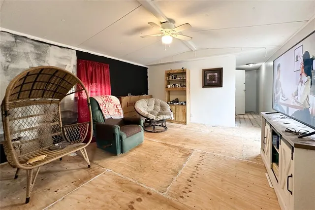 a bedroom with furniture and a window