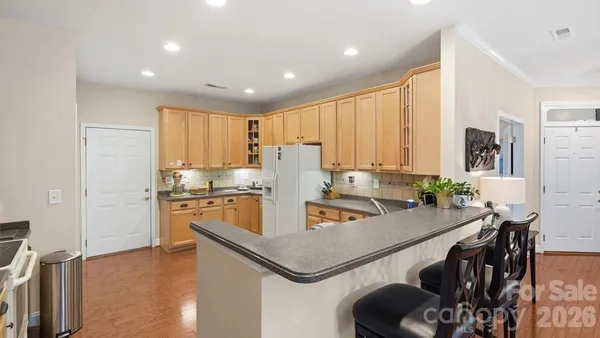 a kitchen with a stove and a microwave