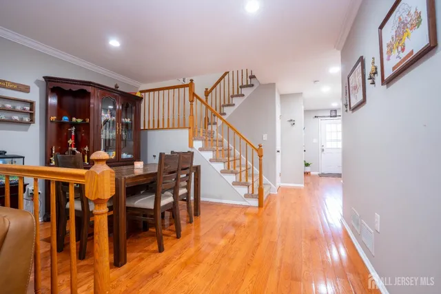 a view of a dining room with furniture and wooden floor