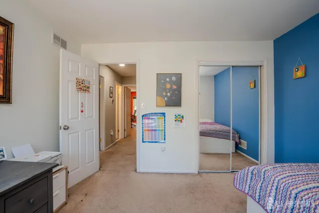 a living room with a bed and furniture