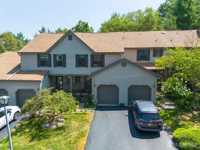 a car parked in front of white house