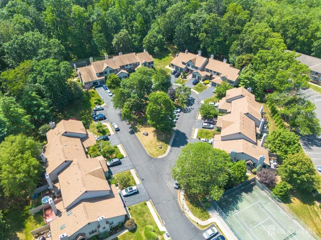 an aerial view of a house with yard swimming pool and outdoor seating