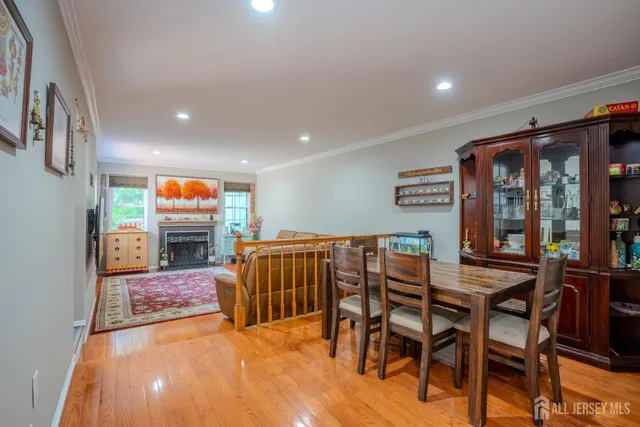 a dining room with furniture and a floor to ceiling window