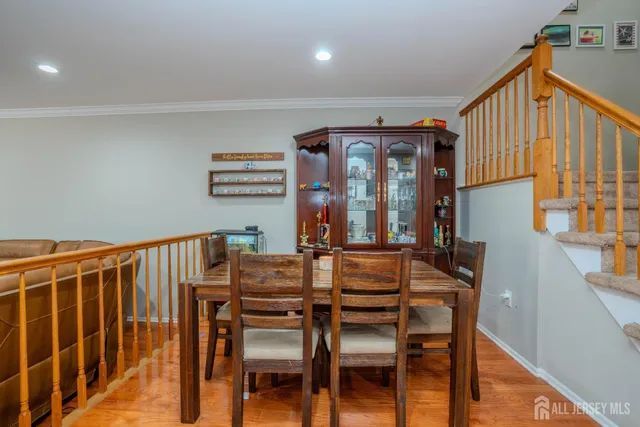 a view of a dining room with furniture and window