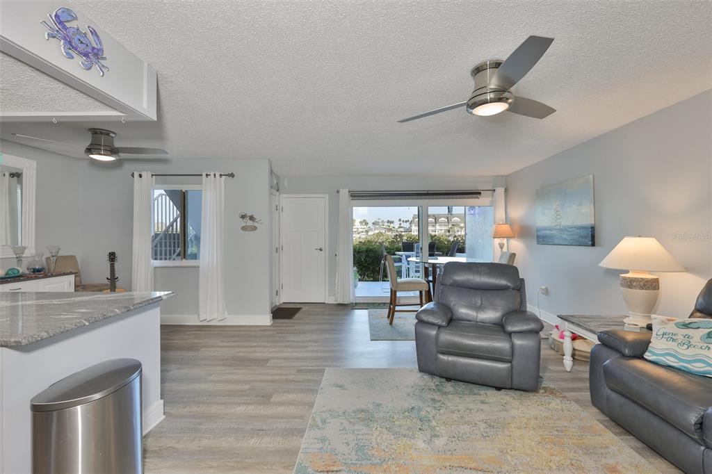 14800 Walsingham Road, Unit 1203 Largo, FL 33774 - Photo 12 of 68 a living room with furniture and a wooden floor