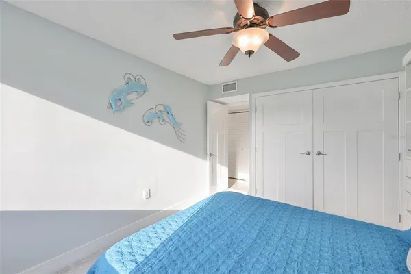 a view of a balcony with furniture and a floor to ceiling window