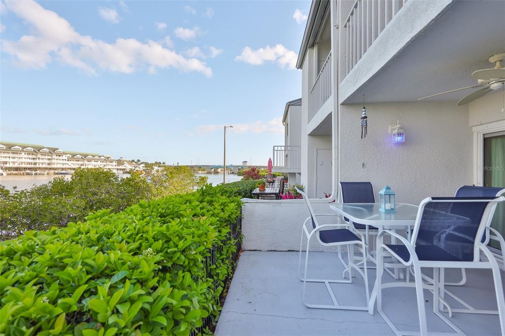 14800 Walsingham Road, Unit 1203 Largo, FL 33774 - Photo 27 of 68 a view of an outdoor dining space with furniture