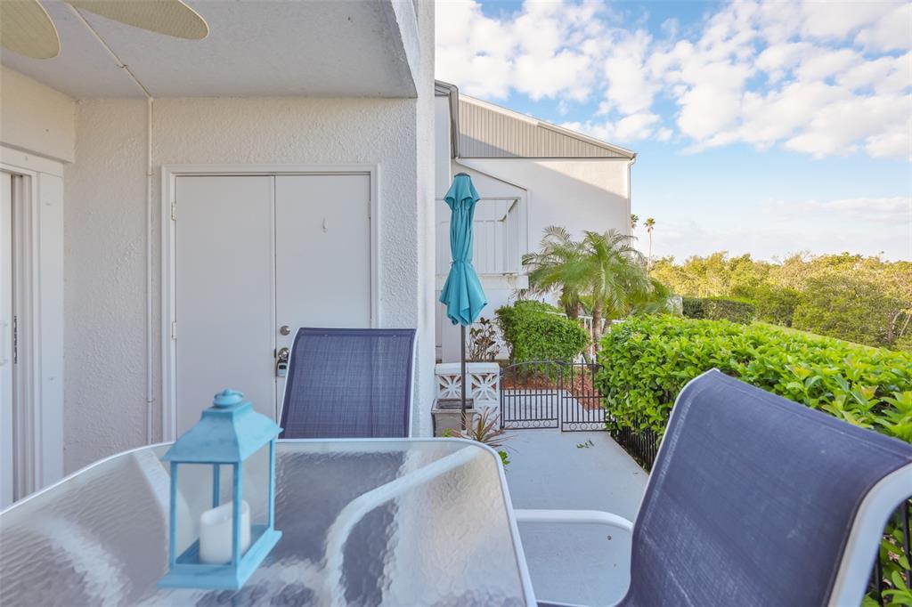 14800 Walsingham Road, Unit 1203 Largo, FL 33774 - Photo 28 of 68 a view of a patio in backyard