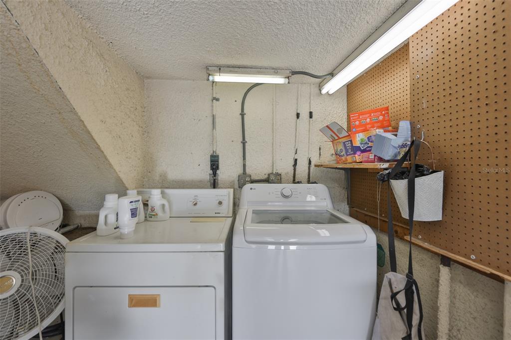 14800 Walsingham Road, Unit 1203 Largo, FL 33774 - Photo 30 of 68 a utility room with dryer and washer