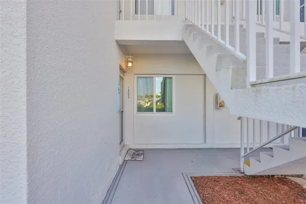 a view of a terrace with a garden and trees