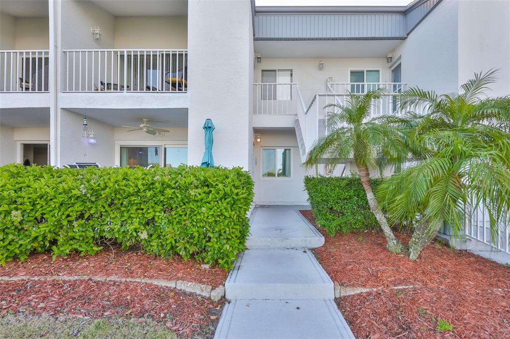 14800 Walsingham Road, Unit 1203 Largo, FL 33774 - Photo 34 of 68 a view of a garden with pathway