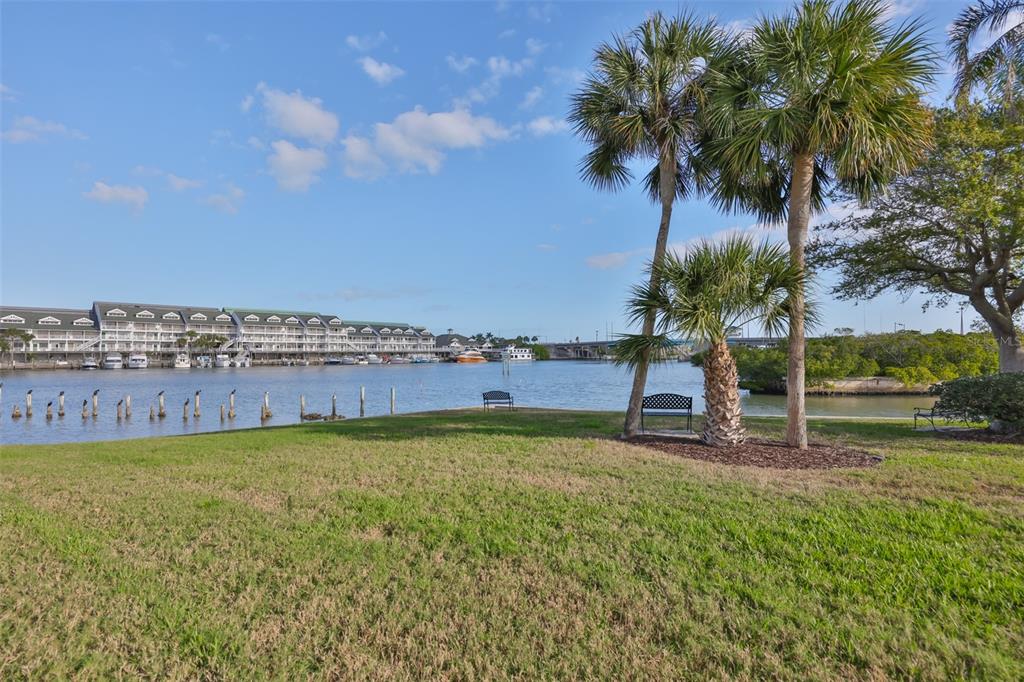 14800 Walsingham Road, Unit 1203 Largo, FL 33774 - Photo 36 of 68 a view of a terrace with a garden and trees