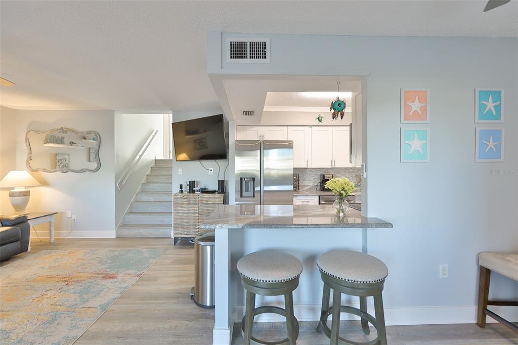 14800 Walsingham Road, Unit 1203 Largo, FL 33774 - Photo 4 of 68 a dining room with furniture and a window