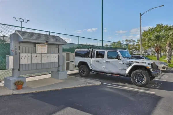 a view of a swimming pool with a yard and seating area
