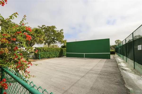 a view of a swimming pool with a patio and lake view