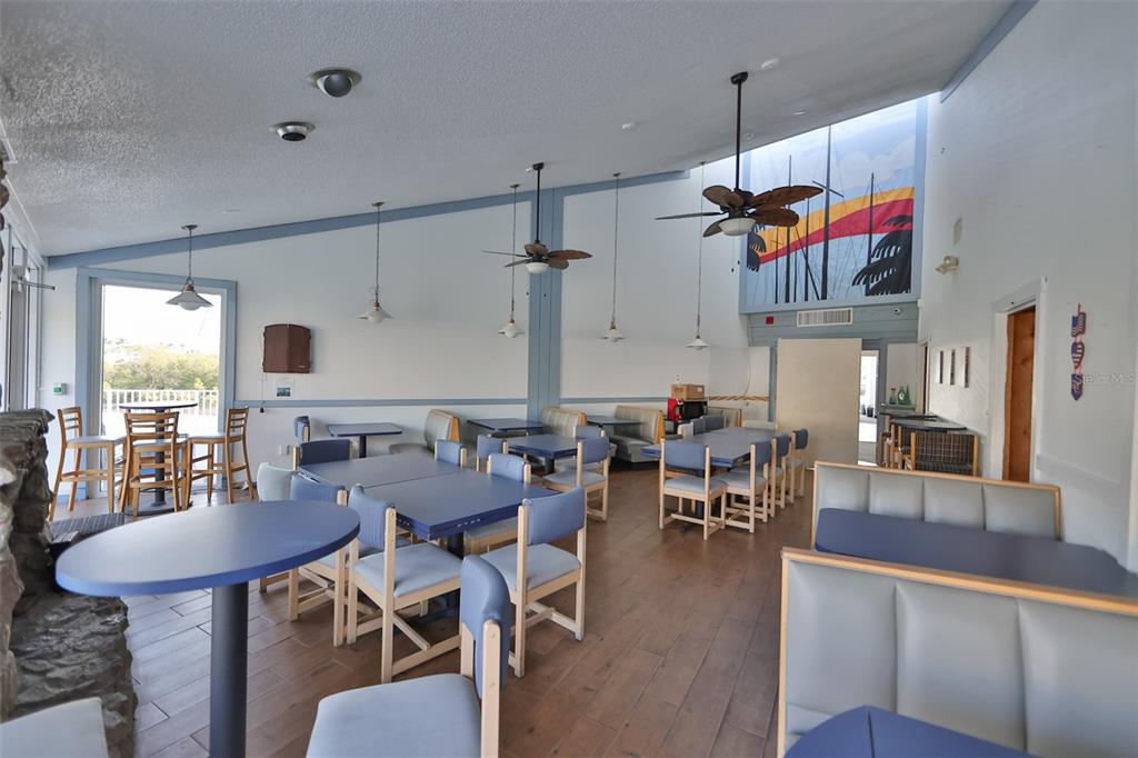 14800 Walsingham Road, Unit 1203 Largo, FL 33774 - Photo 54 of 68 a view of a dining room with furniture window and outside view
