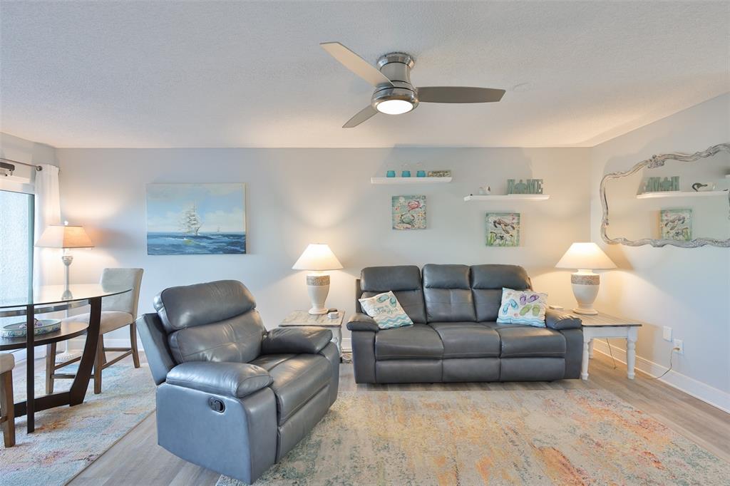14800 Walsingham Road, Unit 1203 Largo, FL 33774 - Photo 10 of 68 a living room with furniture and a wooden floor