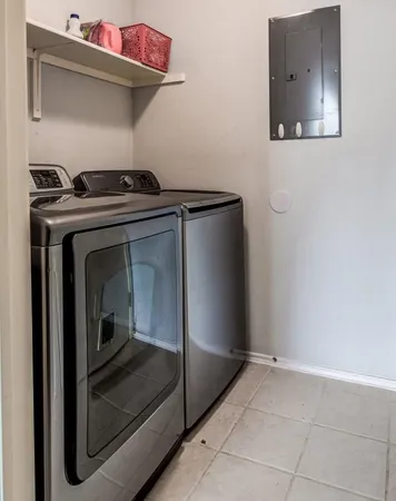 a bedroom with a bed and a book shelf