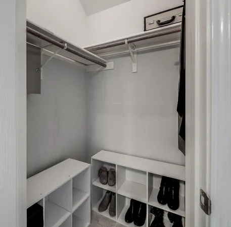 a view of a patio with a table and chairs next to a yard