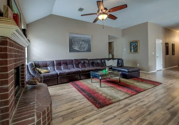 a living room with furniture and a rug