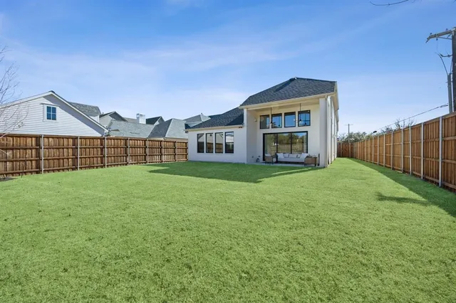 a view of a house with a yard and porch