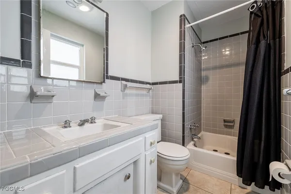 a utility room with closet dryer and washer
