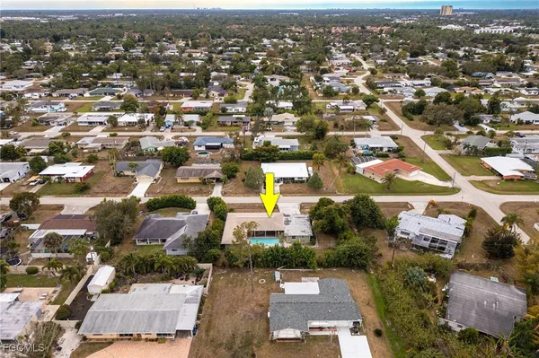 an aerial view of residential houses with outdoor space