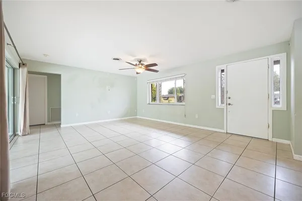 a view of an empty room with a window