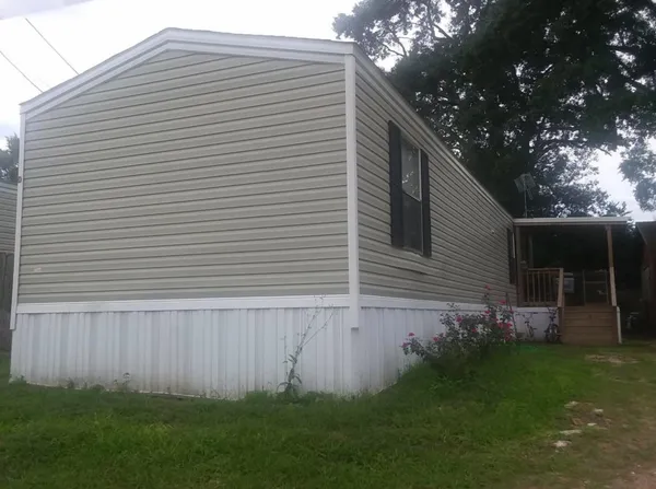 a backyard of a house with lots of green space