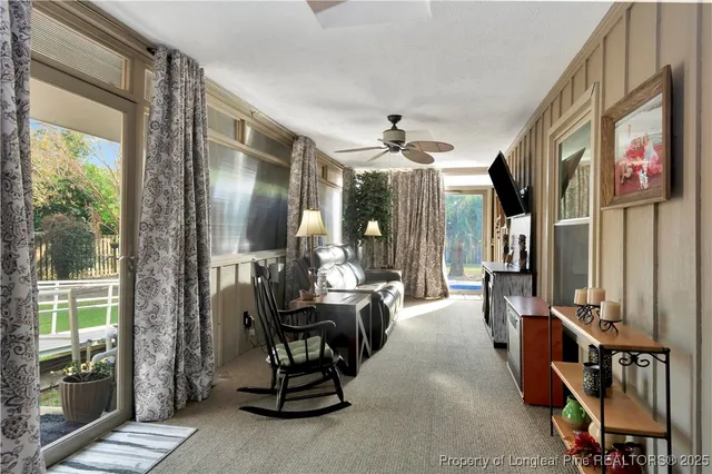 a view of a livingroom with furniture and windows