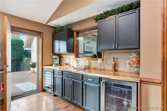 a kitchen with a sink and a refrigerator