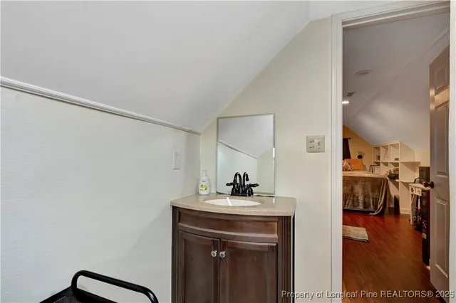 a kitchen with a sink and a mirror