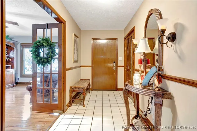 a view of an entryway with wooden floor and door