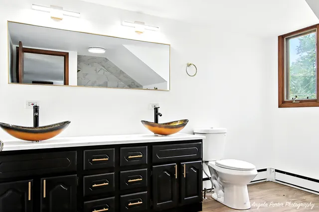 a bathroom with a tub sink and shower