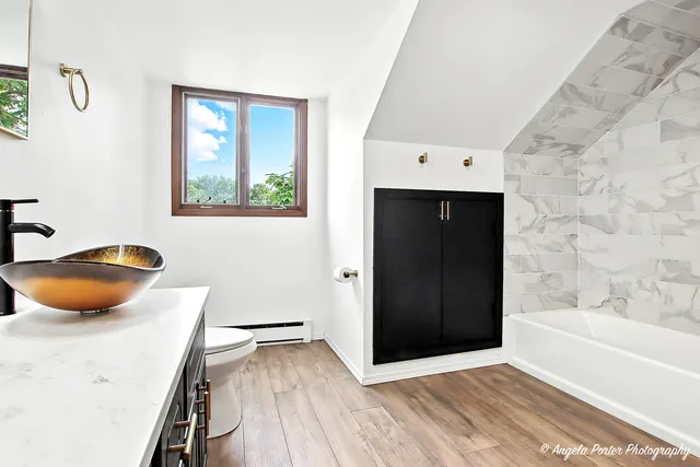 a big room with closet and fireplace