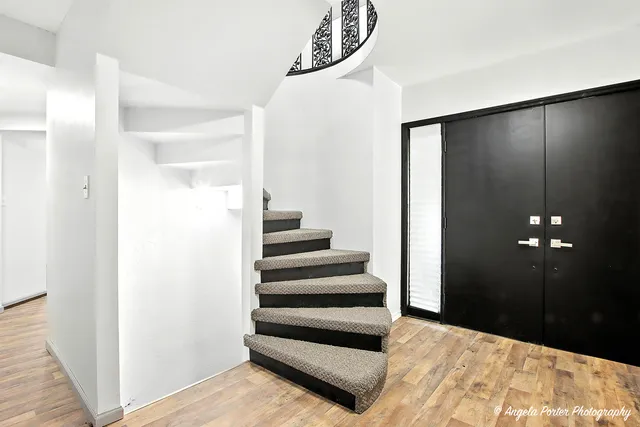 a view of a wooden deck with a large window