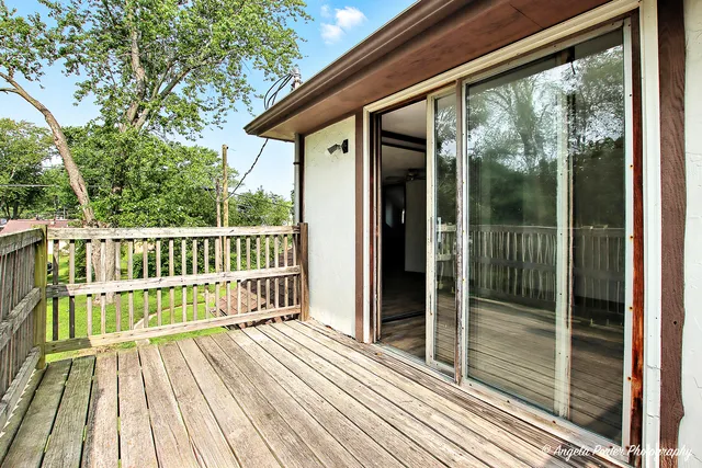 a view of a wooden roof deck